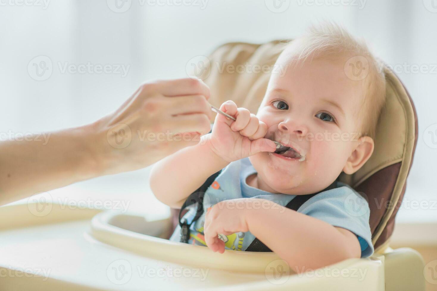 mother feeding her baby breast porridge day photo