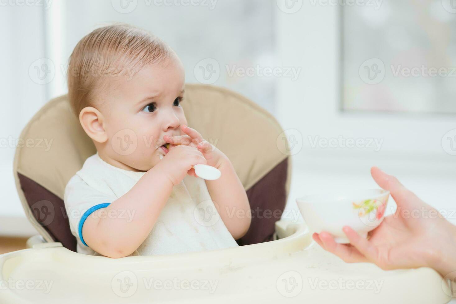 mother feeding her baby breast porridge day photo