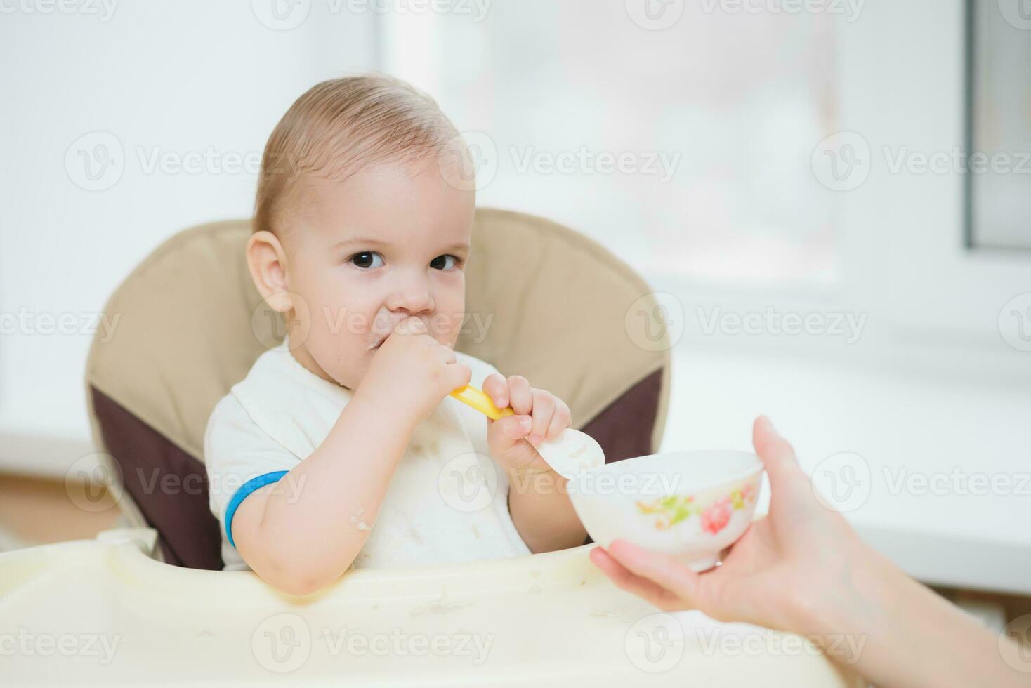 mother feeding her baby breast porridge day photo