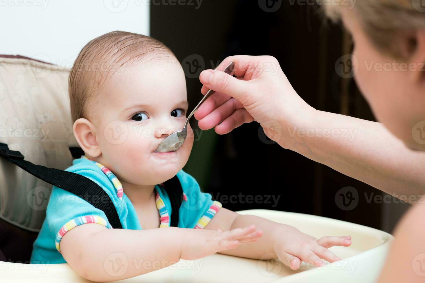 mother feeding her baby breast porridge day photo