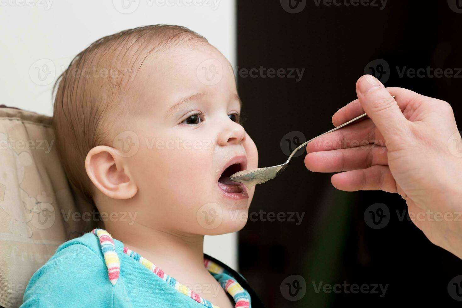 mother feeding her baby breast porridge day photo