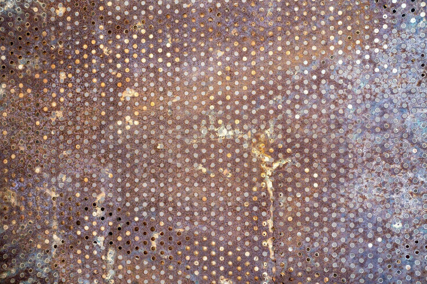 Rusty front grille fragment of a vintage farmer American tractor of production of the beginning of the twentieth century. photo
