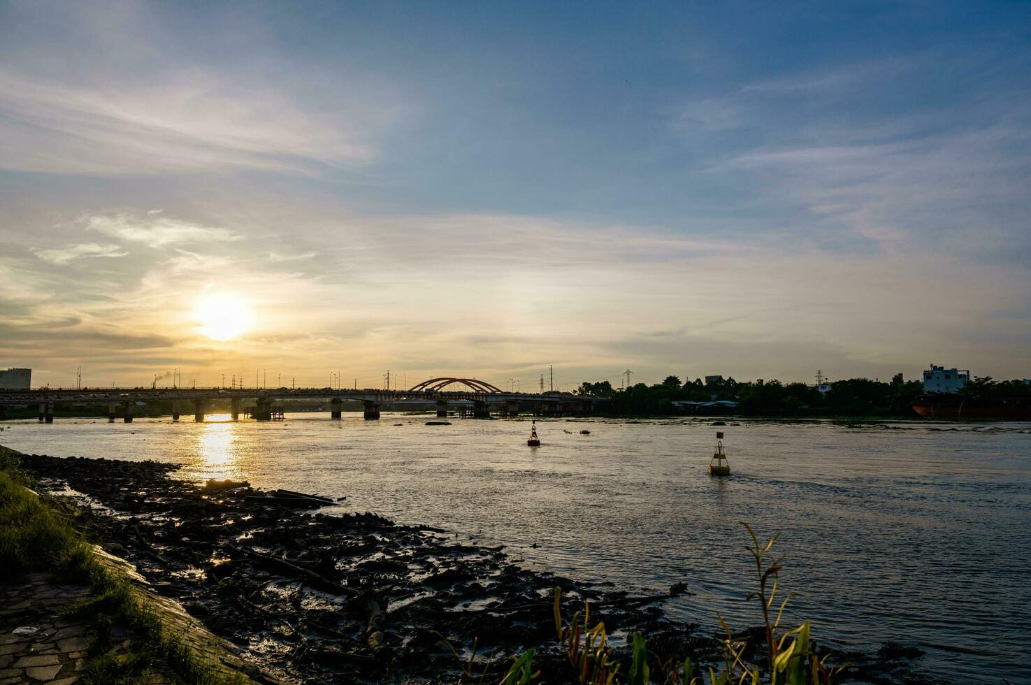 Ho Chi Minh City, Viet Nam 11 July 2023 Sunset silhouettes on Binh Trieu bridge in Ho Chi Minh City photo