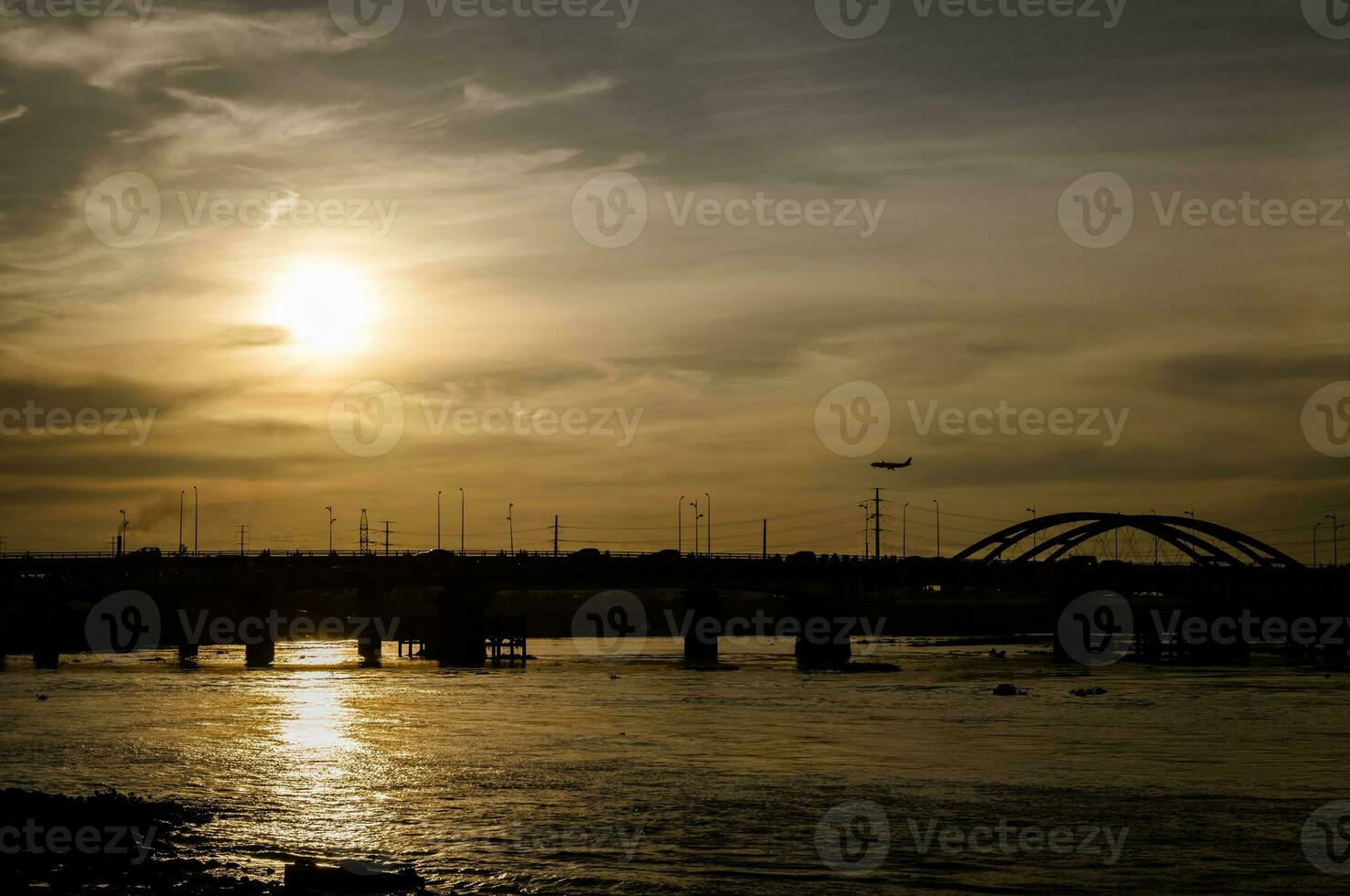 Sunset silhouettes on Binh Trieu bridge in Ho Chi Minh City photo