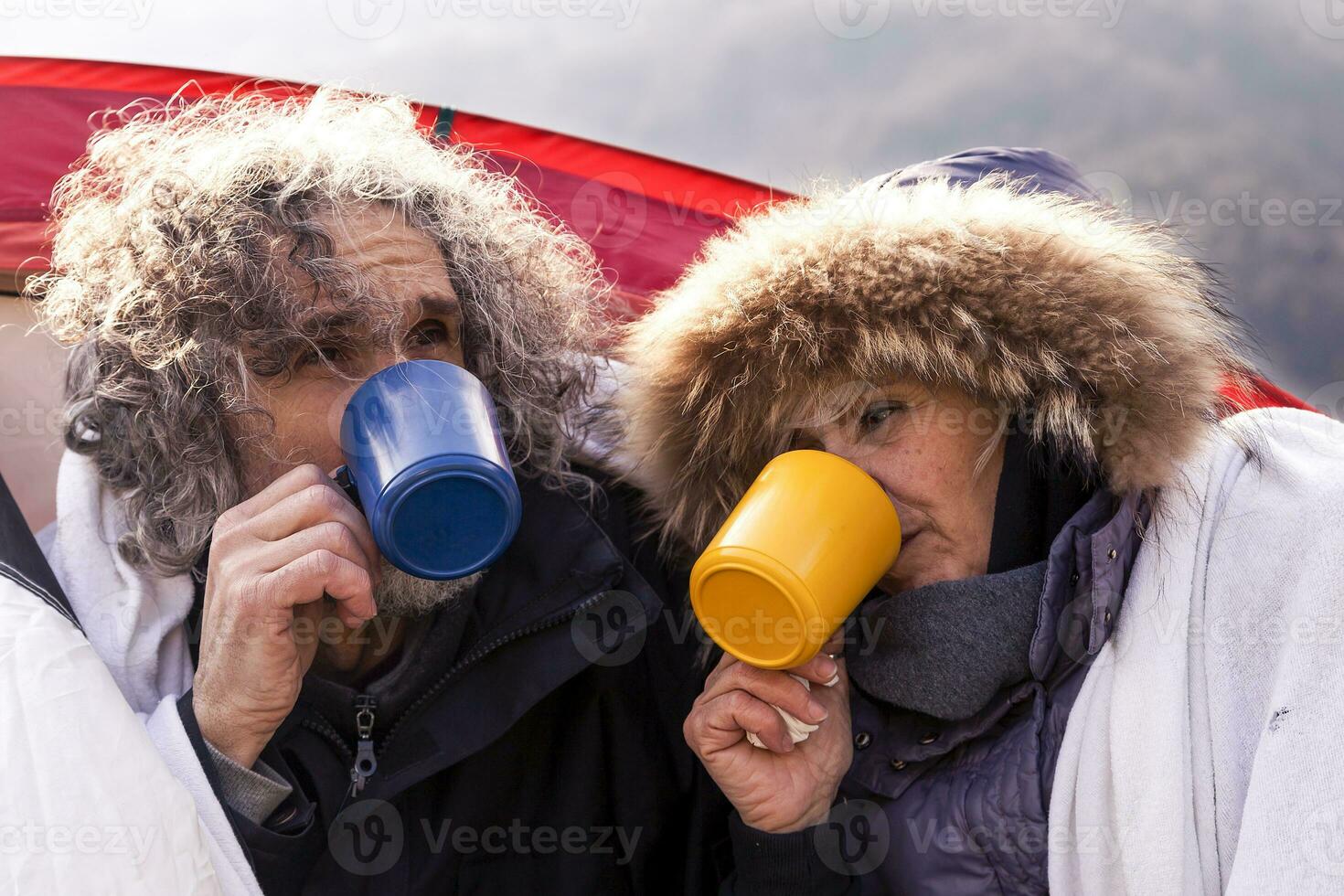 beautiful mature couple relaxing and drinking hot coffee photo