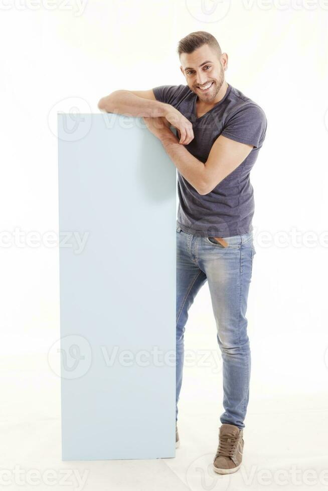 portrait of young man showing sign isolated on white photo