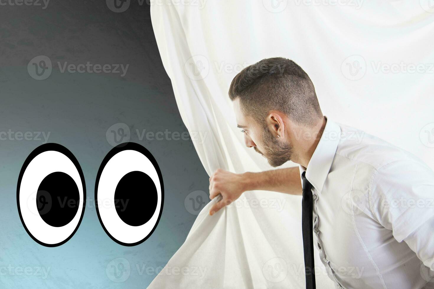 businessman pulls the curtain and discovers two eyes photo