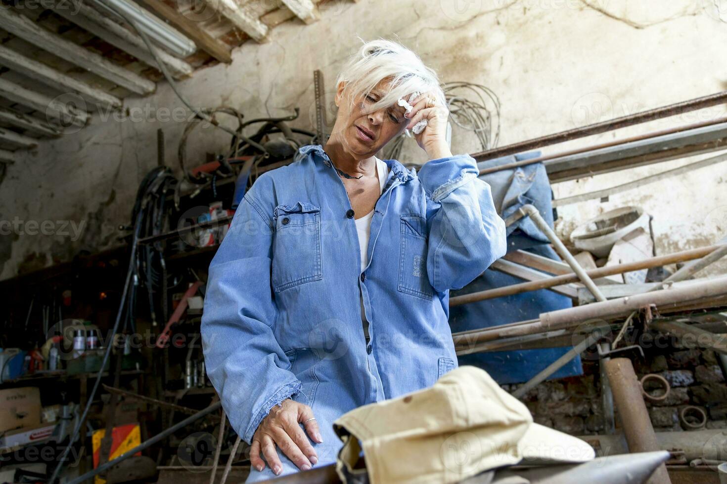 beautiful lady at work in his old workshop photo