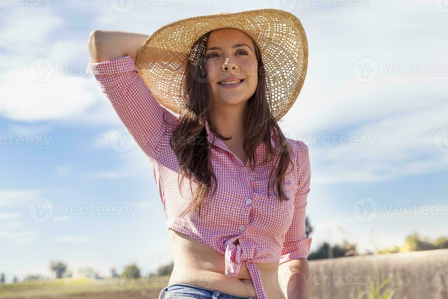 pretty young woman on bike in a country road photo