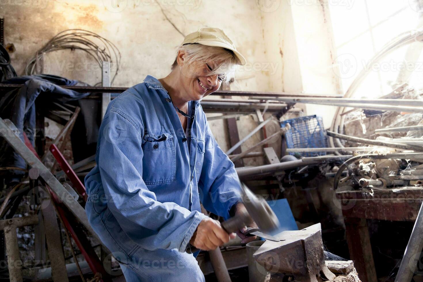 beautiful lady at work in his old workshop photo