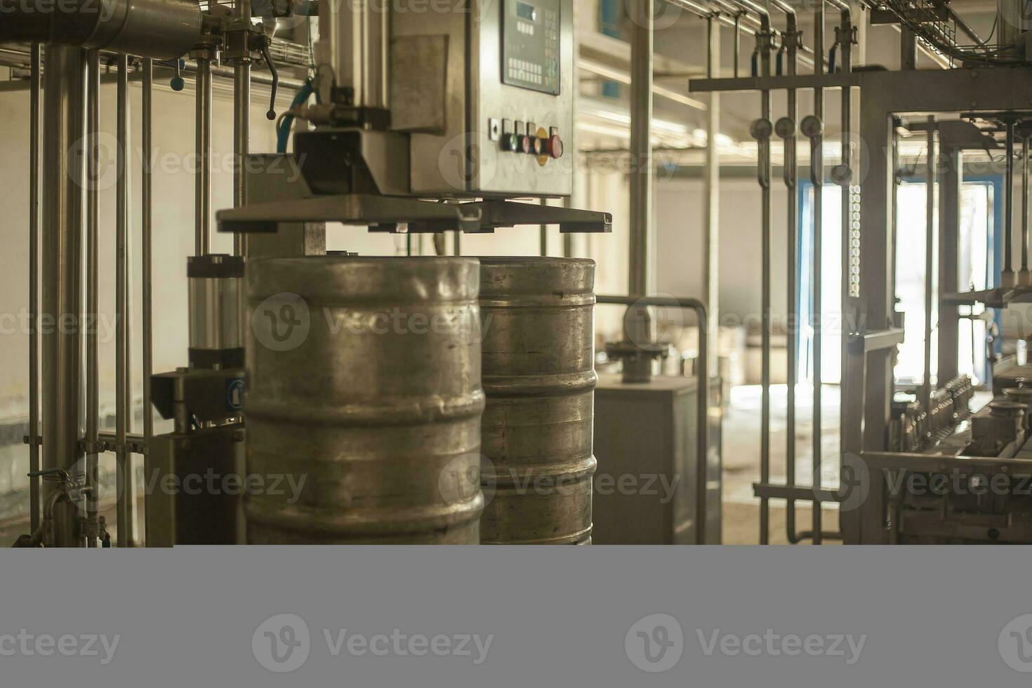 Beer kegs on the production line in the factory photo