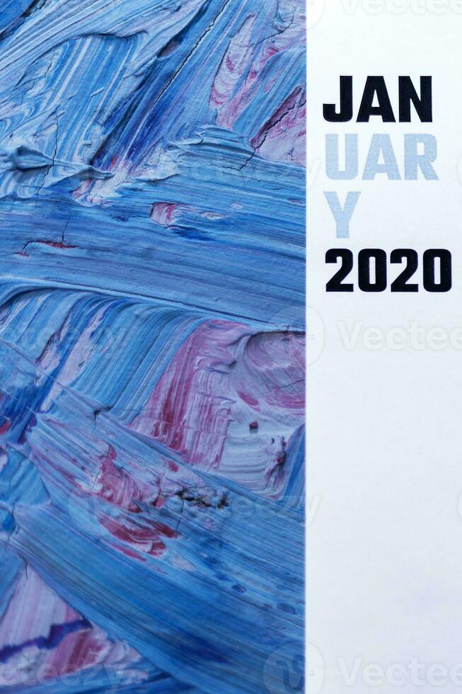 2020 calendar on trendy classic blue colored backdrop photo