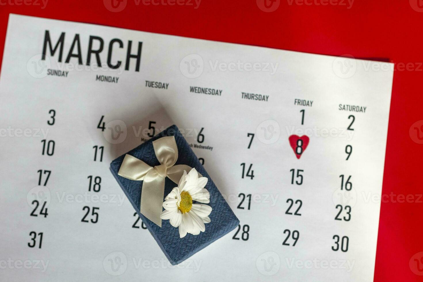 International women day. March 2020 monthly calendar with 8th march marked and giftbox photo