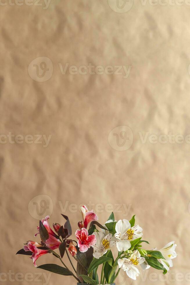 Woman holds up a glass jar of beautiful colorful spring flowers photo