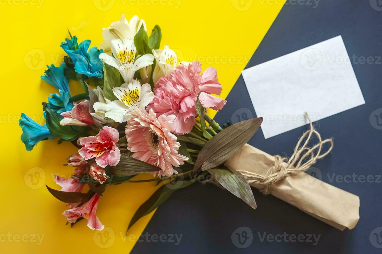 Bouquet of flowers with a card photo