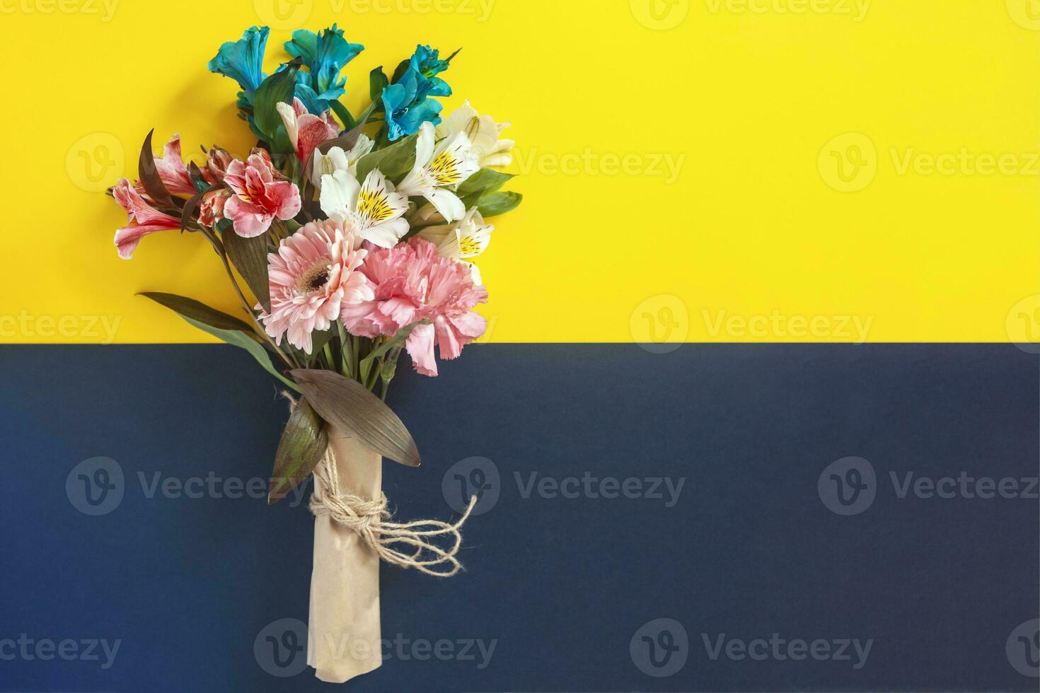 Bouquet of flowers with a card photo