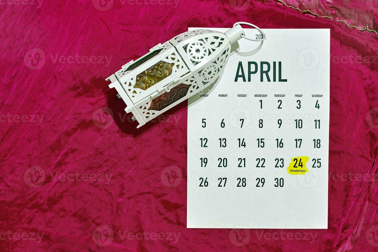 April monthly calendar on red photo