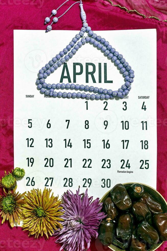 April monthly calendar on red photo