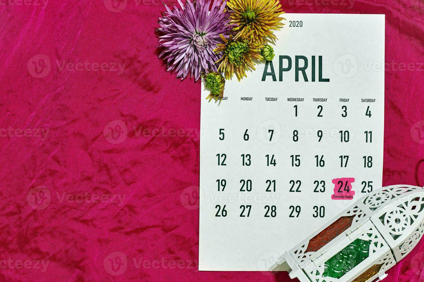 April monthly calendar on red photo