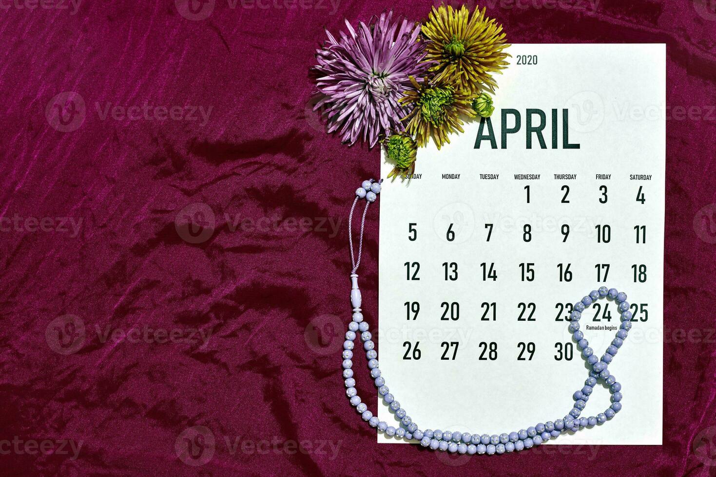 April monthly calendar on red photo