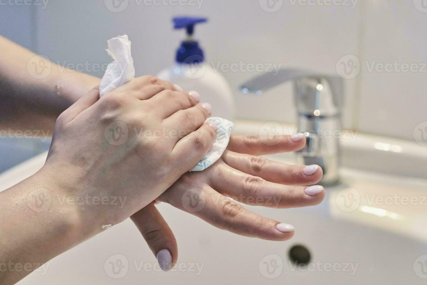 Woman washing hands photo