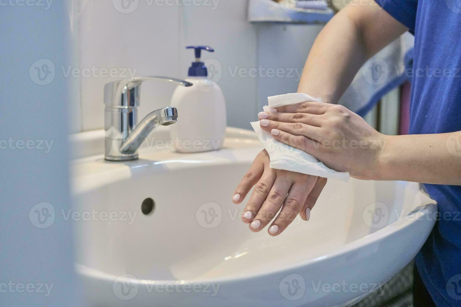 Woman washing hands photo