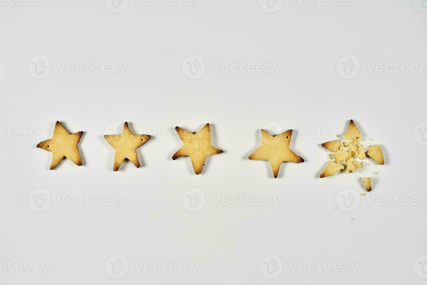 Four stars ranking. 4 baked star shape cookies photo