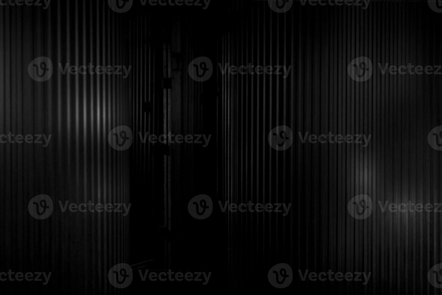 Black metal. Metal corrugated background with free space for text. photo