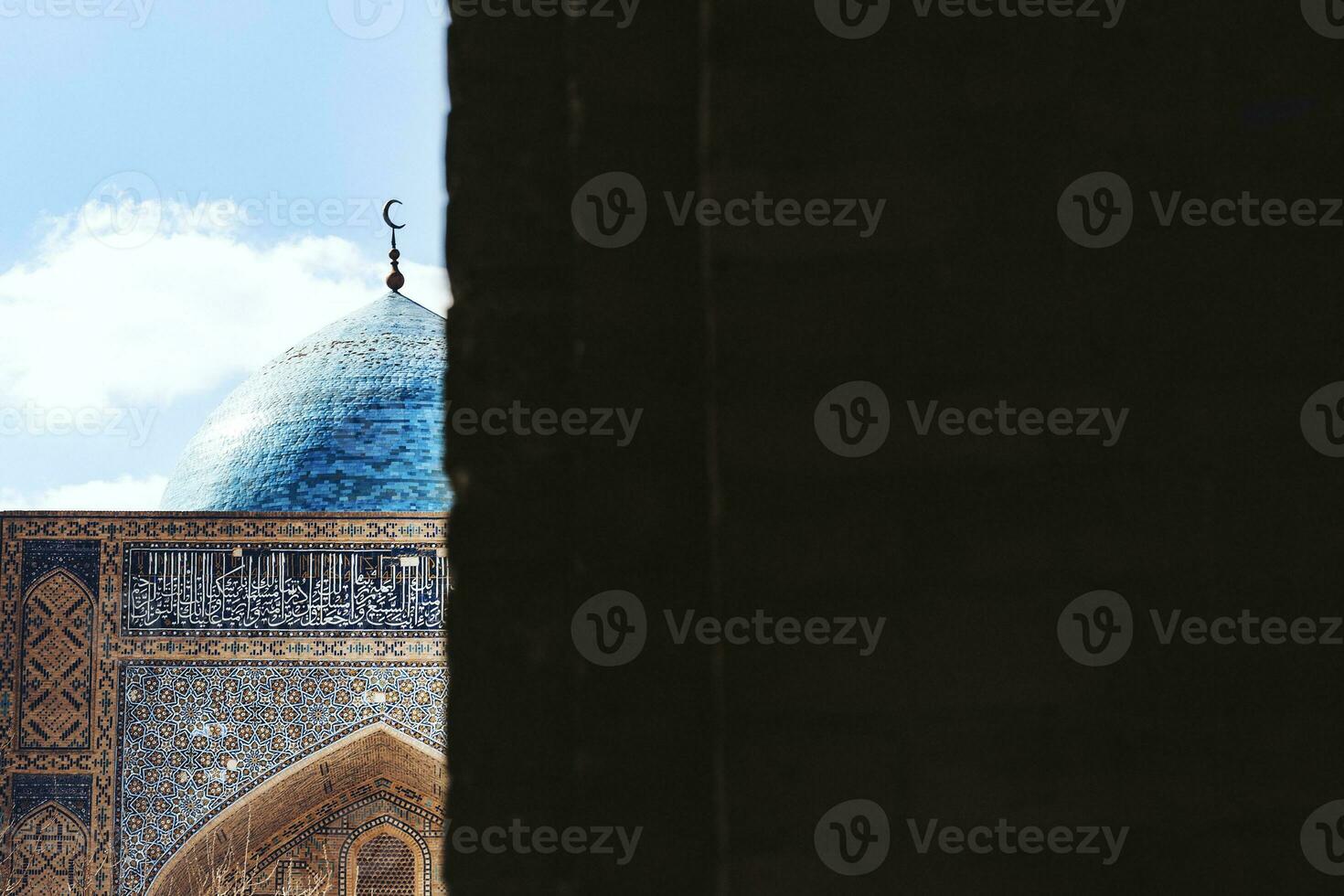 View of the beautiful blue dome of The Mosque Kalyan. One of the oldest and largest Mosque in Central Asia. Main cathedral mosque of Bukhara photo