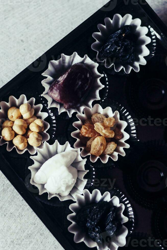 Eid Mubarak. Different iftar sweets. Celebrating Eid Al Adha. Islamic traditional holiday. Eid al-Fitr. Holly month Ramadan. Middle Eastern religious holiday. Dried date fruit. Flat lay, top view. photo