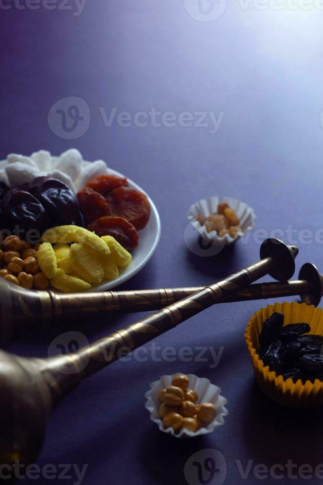 Eid Mubarak. Different iftar sweets. Celebrating Eid Al Adha. Islamic traditional holiday. Eid al-Fitr. Holly month Ramadan. Middle Eastern religious holiday. Dried date fruit. Flat lay, top view. photo