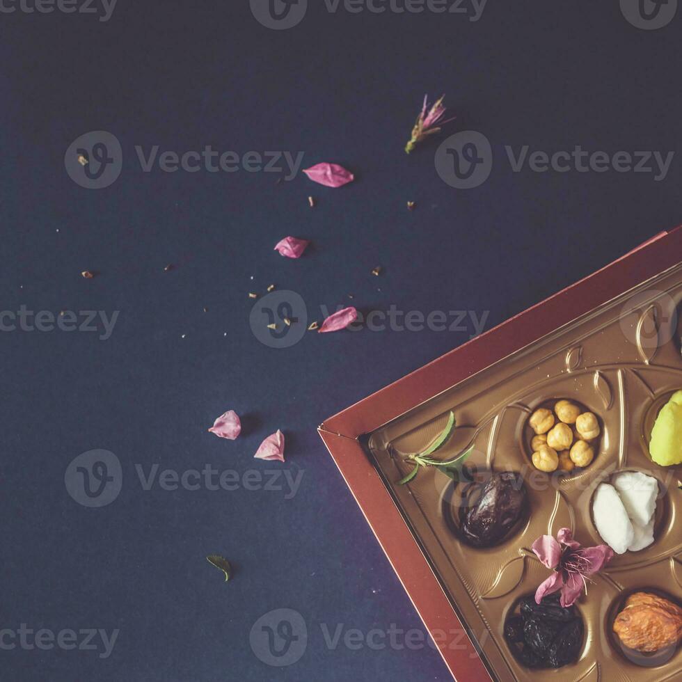 Eid Mubarak. Different iftar sweets. Celebrating Eid Al Adha. Islamic traditional holiday. Eid al-Fitr. Holly month Ramadan. Middle Eastern religious holiday. Dried date fruit. Flat lay, top view. photo