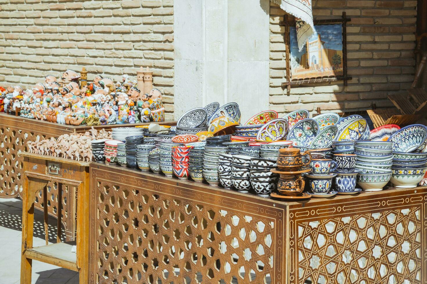 Bukhara, Uzbekistan - March 13, 2019 Uzbek National Souvenirs and Gifts shop in Bukhara. Ceramic shop at streets markets of ancient Bukhara photo