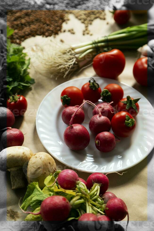 Healthy food background. Assortment of fresh vegetables on paper background photo