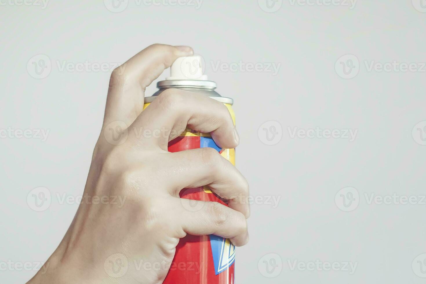 Person using a spray for killing mosquitoes, Aerosol against mosquitoes and flies. Mosquito control or killer spray in use. Aerosol for the control of insects. photo