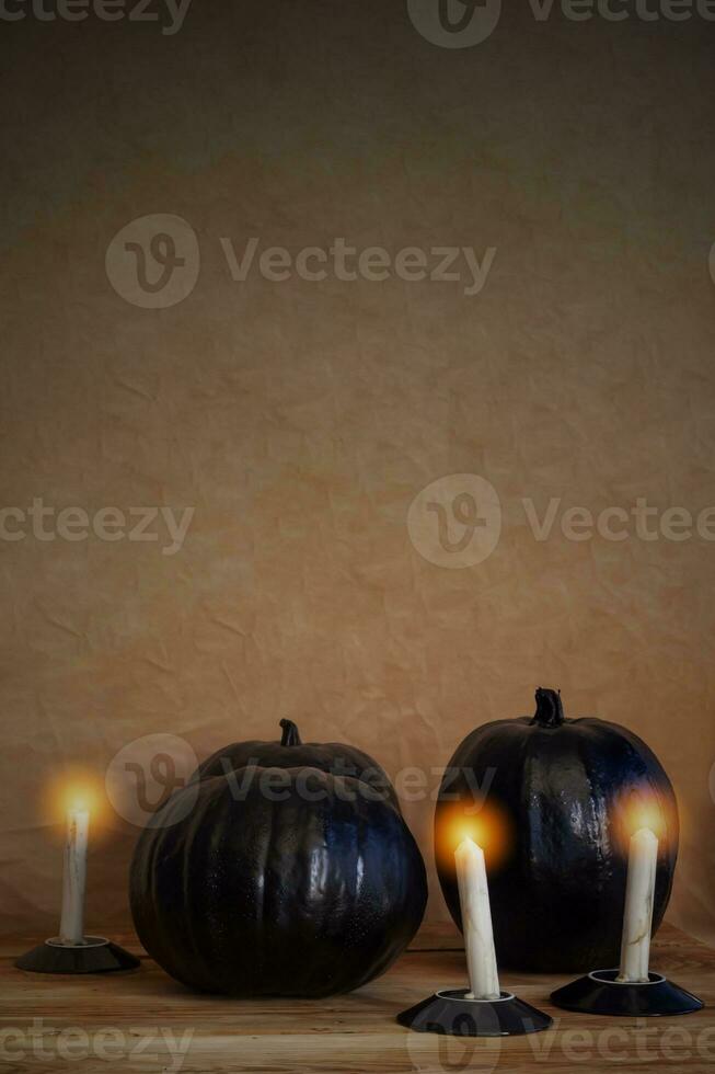 Black halloween pumpkins and candles photo