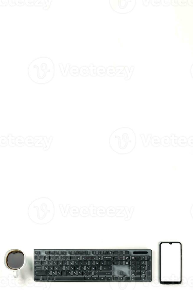 Smartphone with empty display screen, cup of black coffee and black pc keyboard fice table, top view with copy space - stock photo