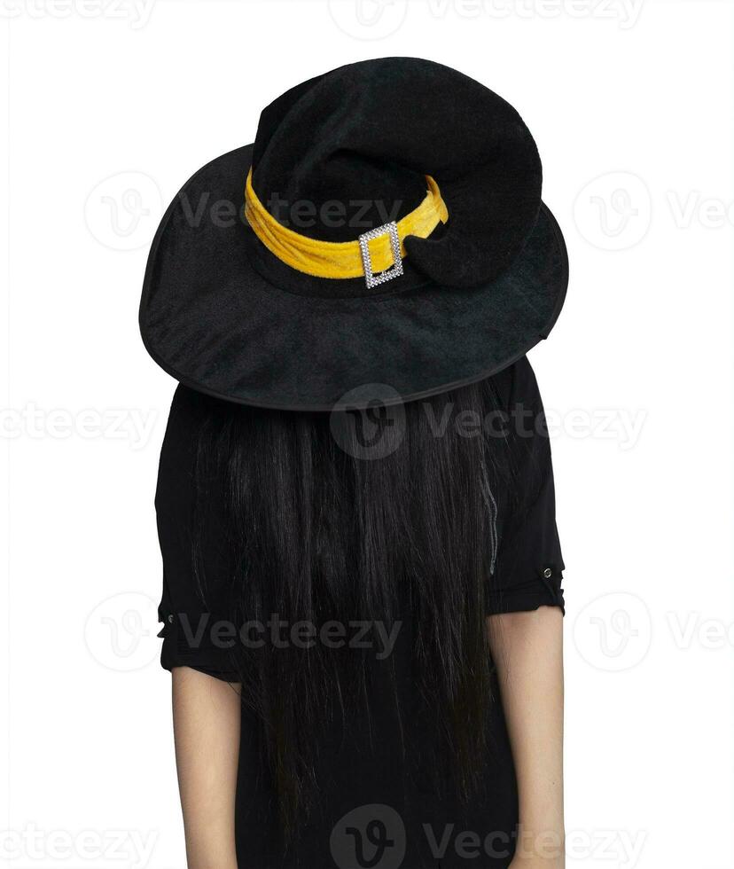 Portrait of young woman in witch costume isolated on white background. Halloween theme on white photo