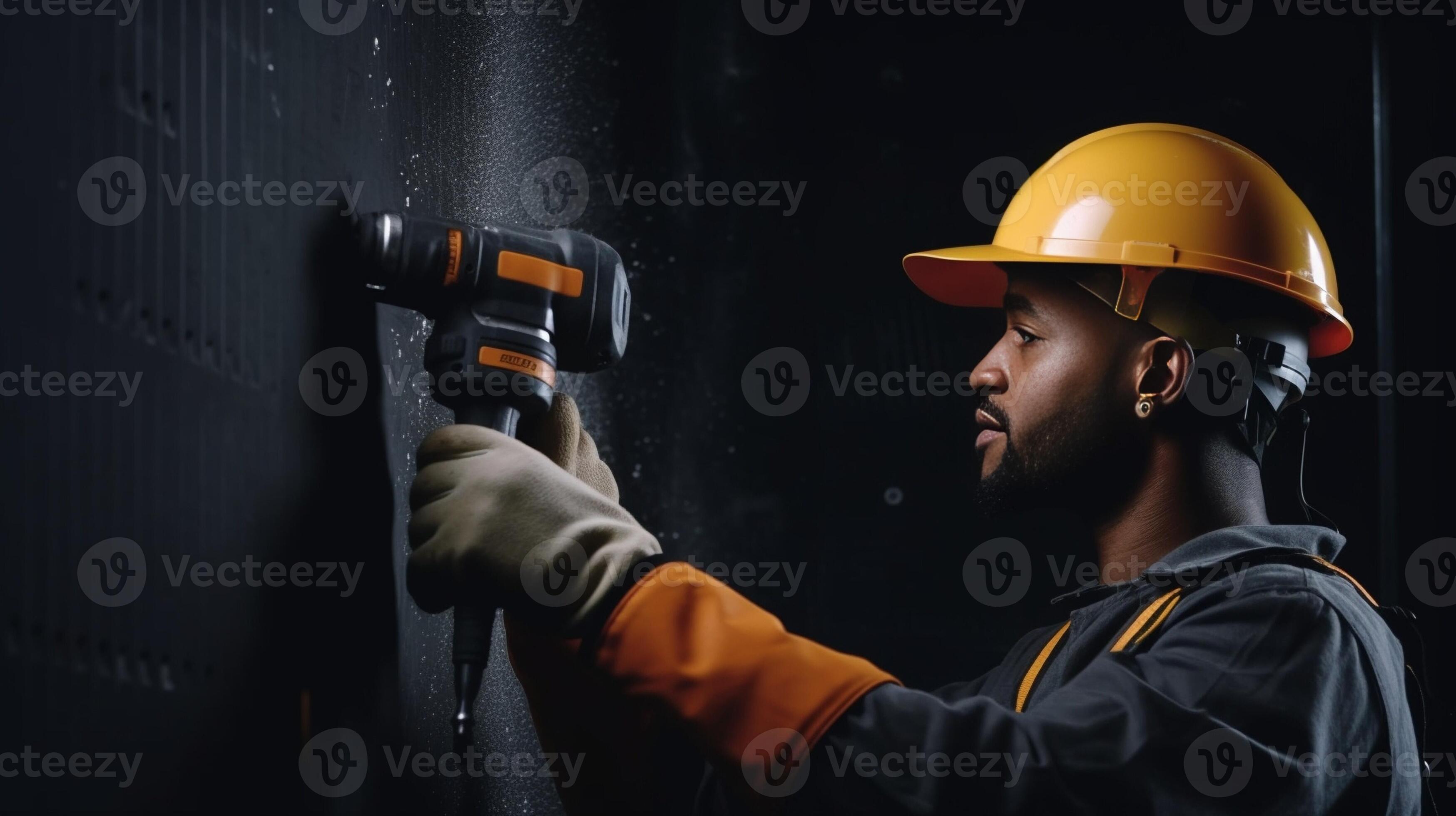 Worker is using a polyurethane foam for gluing drywall at