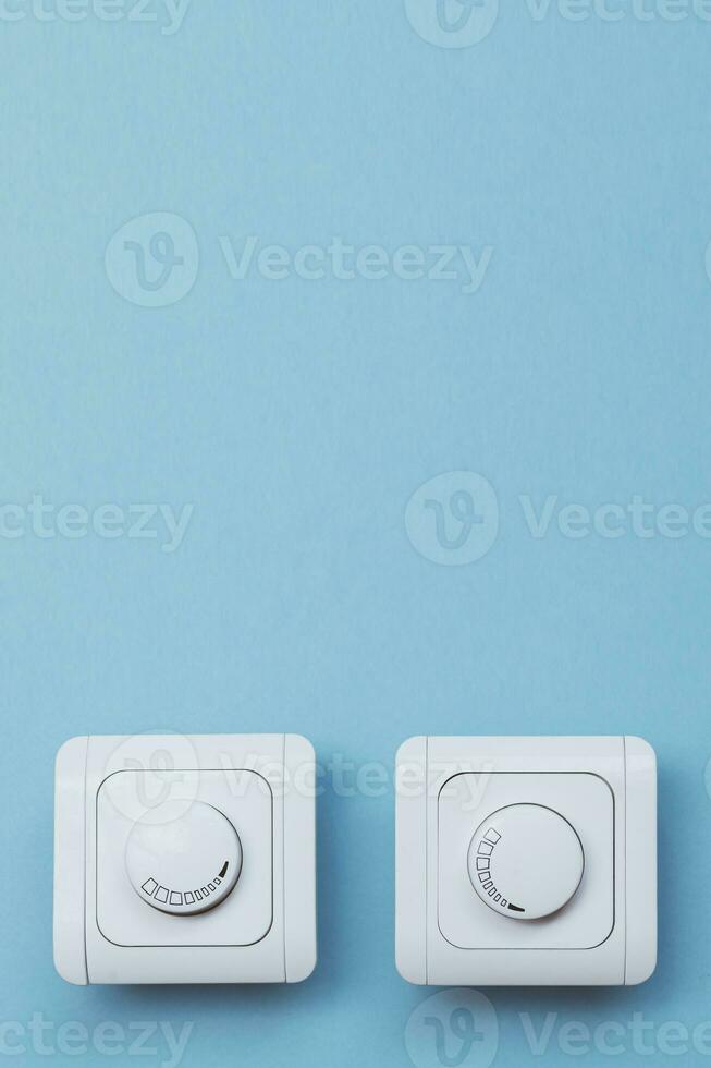 Dimmer Light Switch. A wall switch. Electrician switch. White rolling electricity switch photo