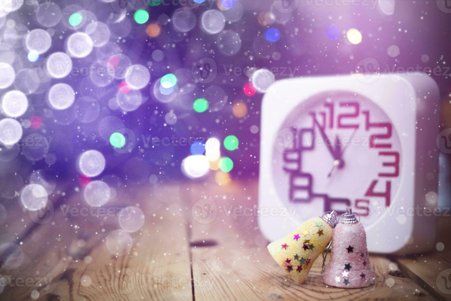 Christmas holiday eve. New year decor with bokeh lights. Magic Winter. Clock at midnight. Greeting new 2020 Year. Clock with blurry magic lights. photo