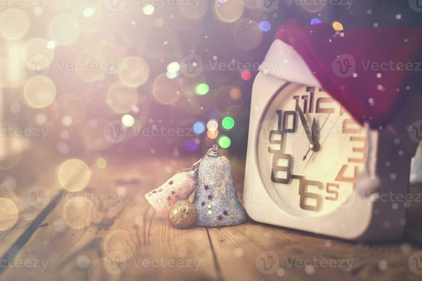 Christmas holiday eve. New year decor with bokeh lights. Magic Winter. Clock at midnight. Greeting new 2020 Year. Clock with blurry magic lights. photo