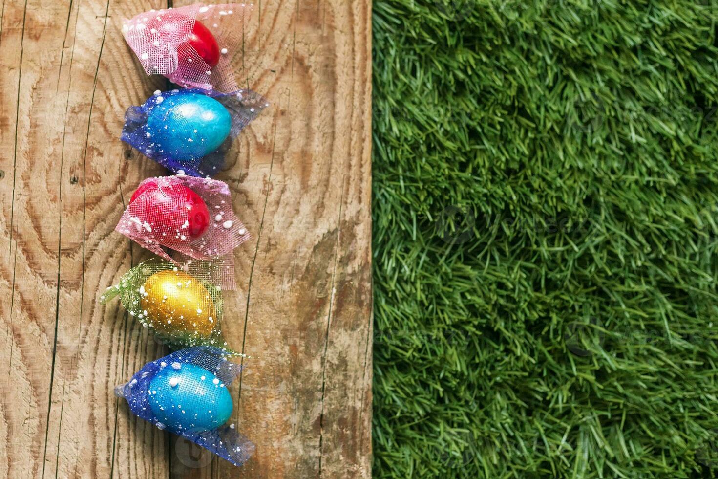 Colorful Easter eggs on the grass photo