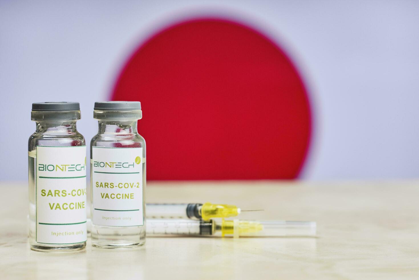 BioNTech Covid-19 vaccine trials. Japan government rollout mass immunization against coronavirus photo