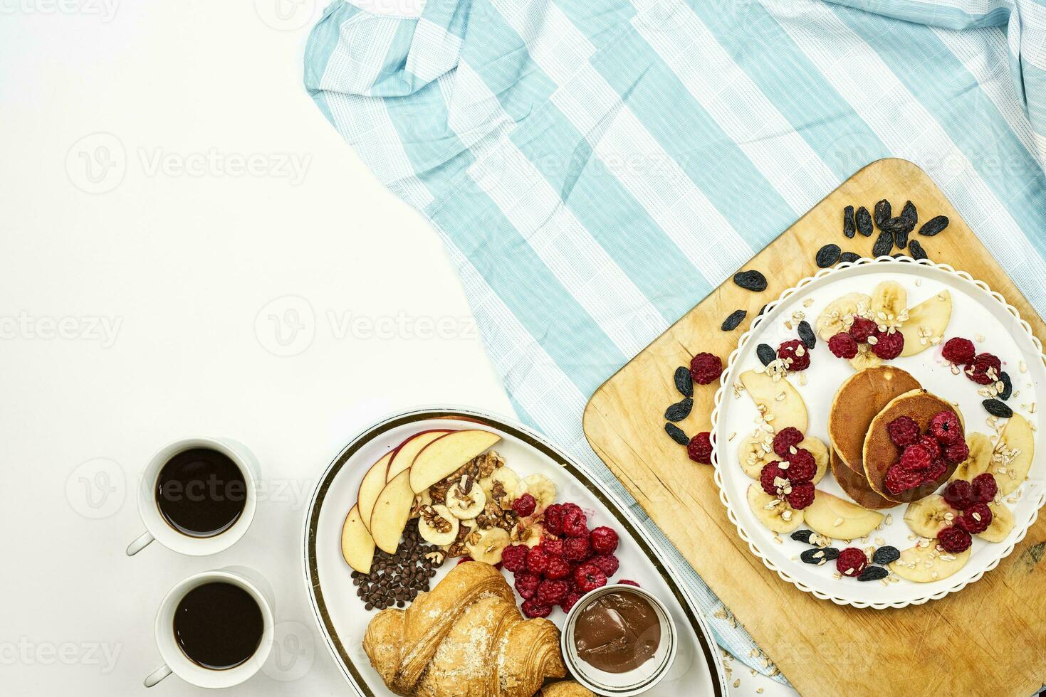 Croissant and pancakes with fruits and chocolate pasta photo