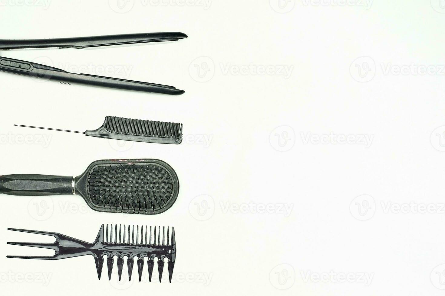 Female Hairdresser tools. Different types of combs and hair iron photo