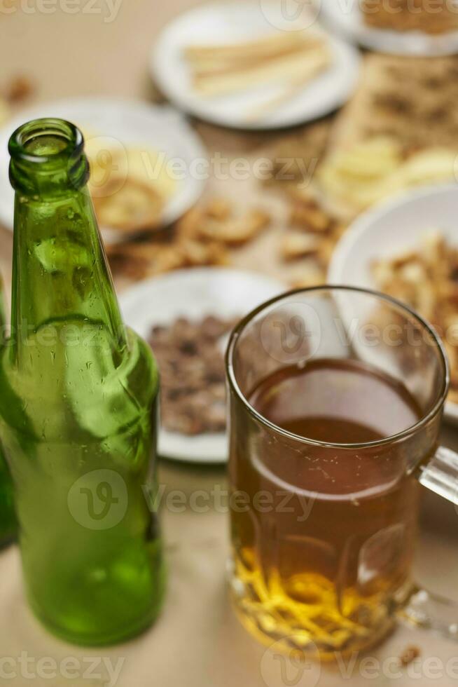 Drinking beer. Table full of beer snacks photo