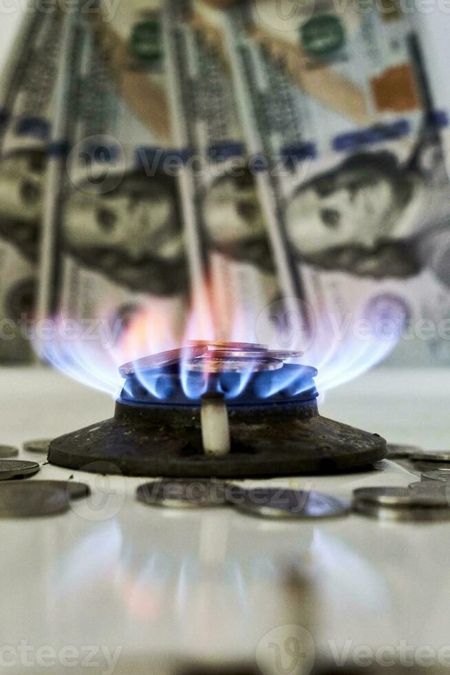 Burning gas stove burner and money photo