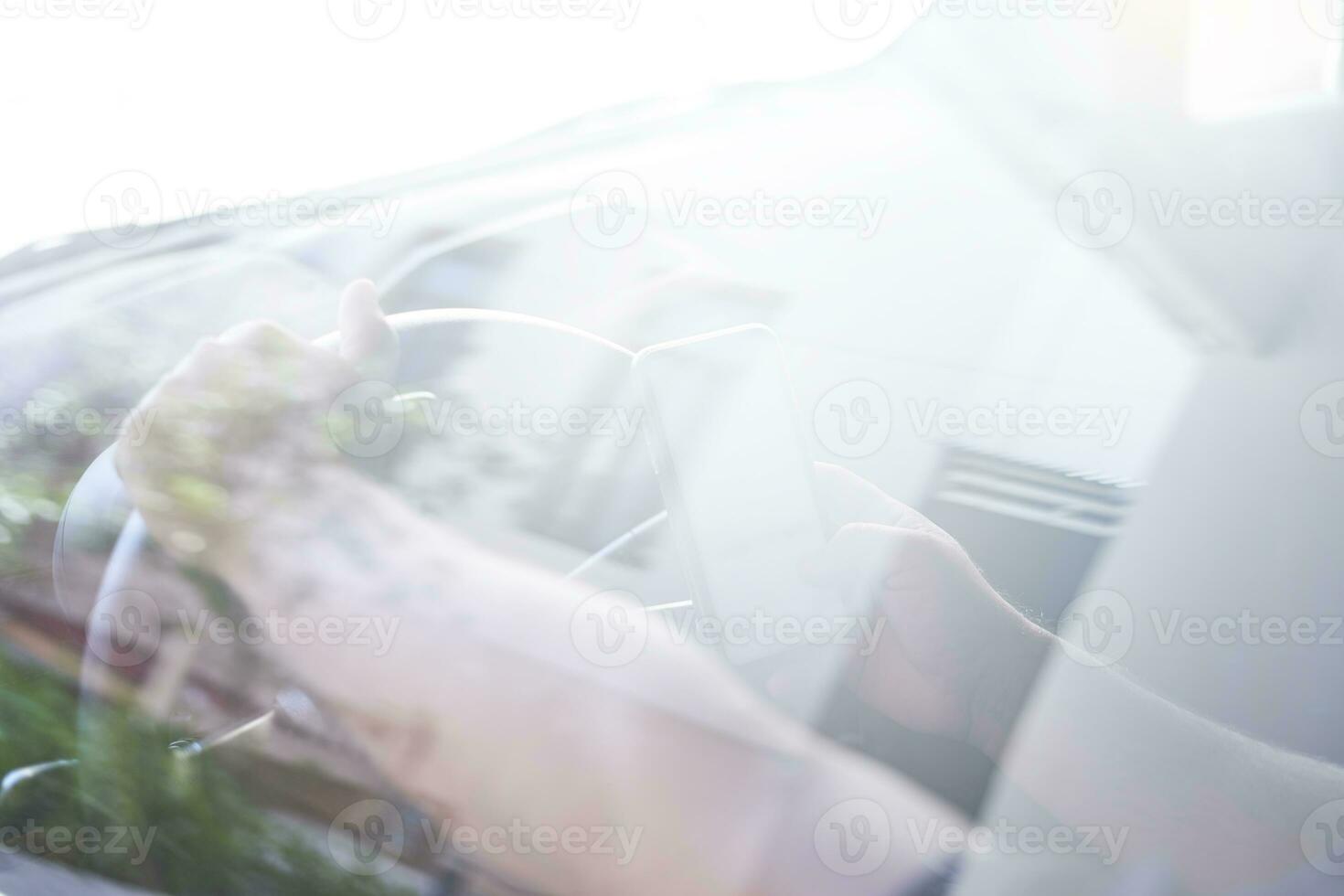 A person driving and texting photo