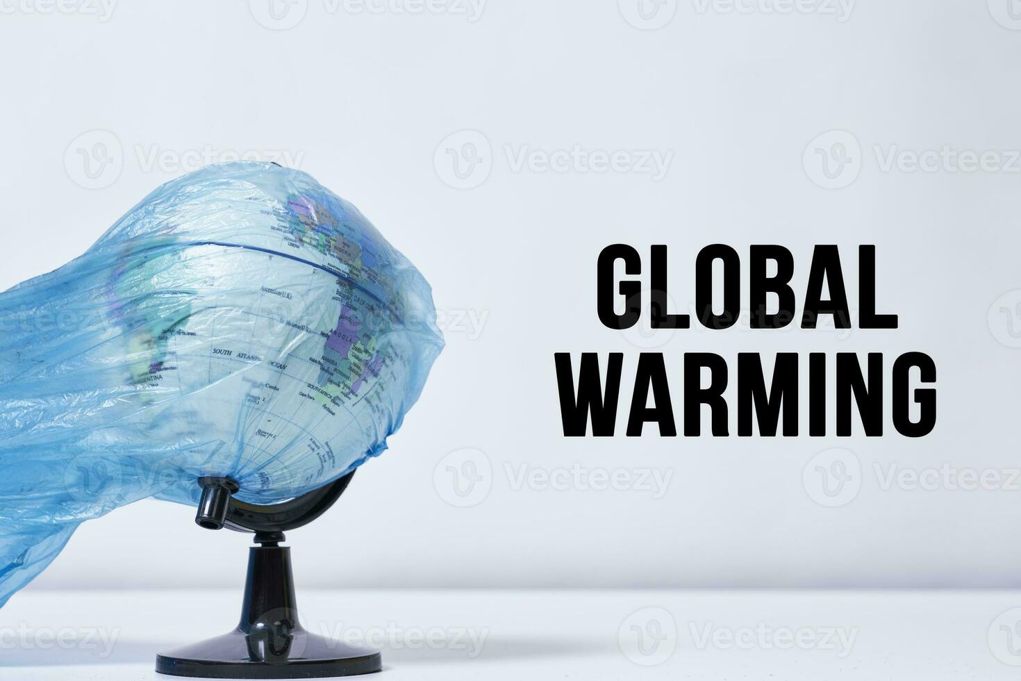 Global warming - the globe in plastic bag photo
